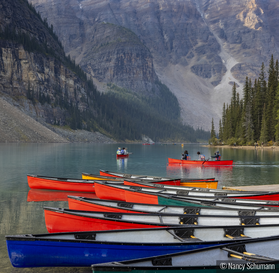Canoeing at Moraine Lake by Nancy Schumann