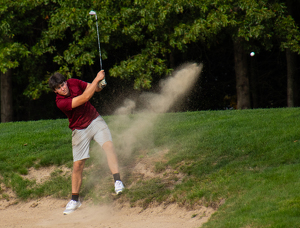 Hitting Out Of The Sandtrap - Photo by Bill Latournes